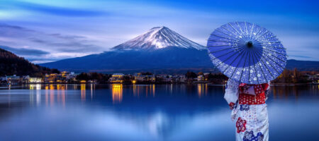 Asian woman wearing japanese traditional kimono at Fuji mountain, Kawaguchiko lake in Japan.