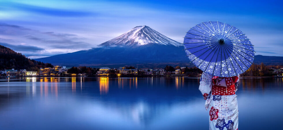 Asian woman wearing japanese traditional kimono at Fuji mountain, Kawaguchiko lake in Japan.